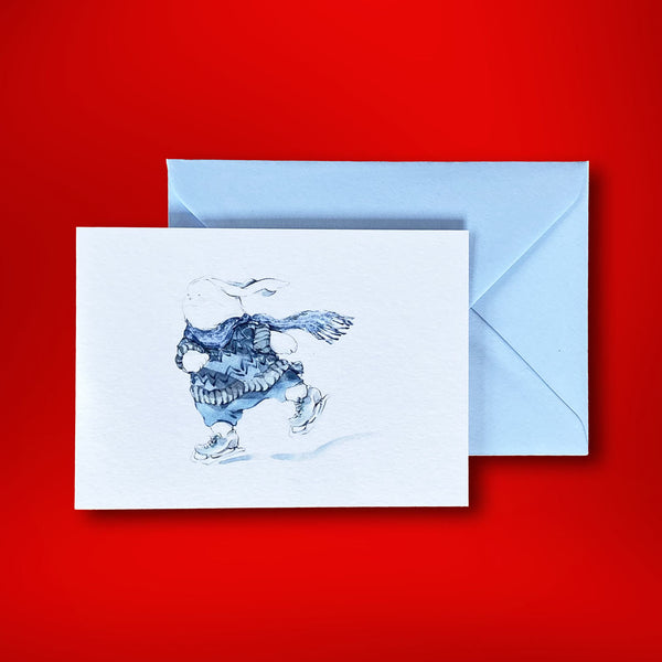 Using varying shades of ice blue, this watercolour of a skating bunny was drawn by Katherine Yan for Pemberly Fox. Supplied with azure blue envelopes, the cards are folded and landscape in orientation.